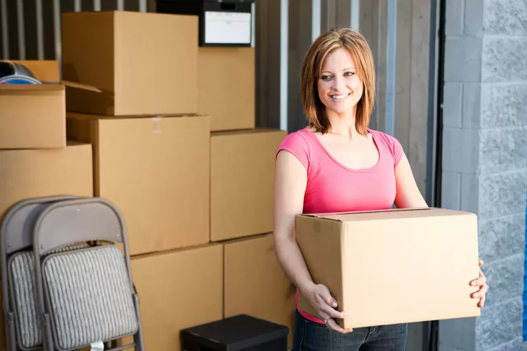woman with boxes in storage
